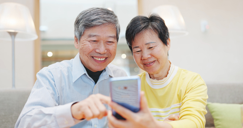 Asian Elder Couple Use Smartphone